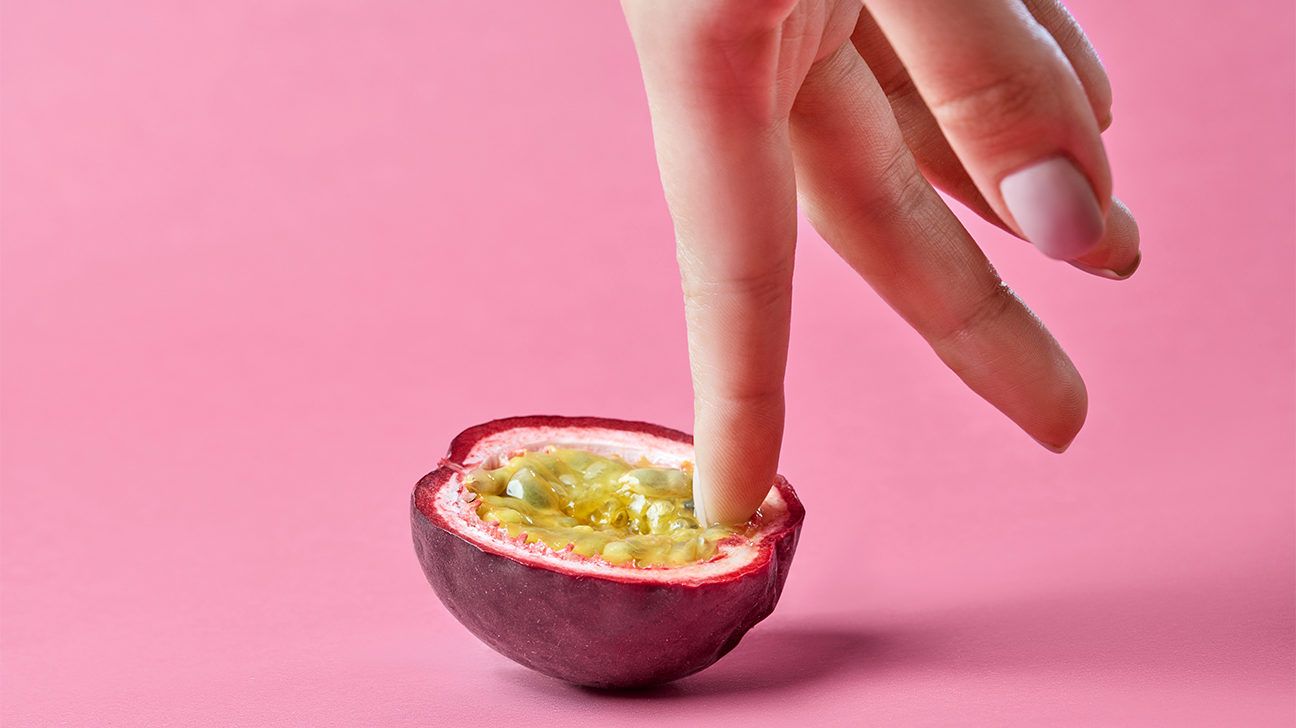 woman touching fruit